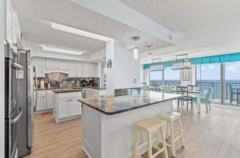 The kitchen also has a large breakfast bar for dining or for serving up great family meals