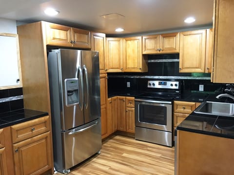 Kitchen with dishwasher, microwave and toaster, blender, waffle maker. 1st Floor