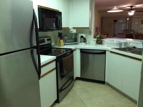 fully equipped kitchen with stainless appliances 