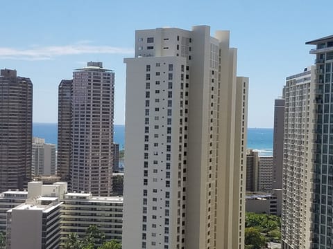 peek of the ocean and waves from window view