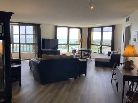 Living area with new flooring and Smart tv.