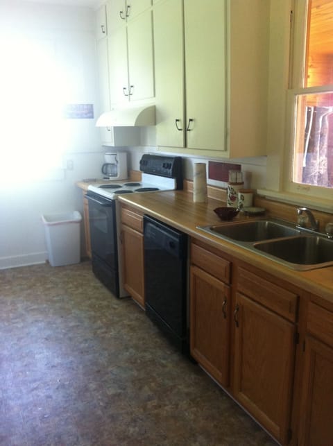 Full kitchen with microwave and fridge with ice maker!