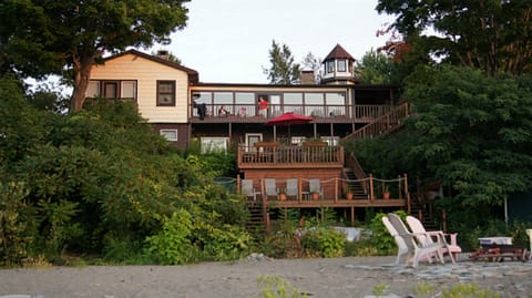 Apartment opens to three levels of decks leading to our beach.