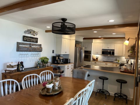 Bright and open kitchen offers seating for 11 people