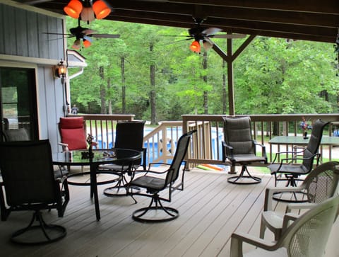 Huge, fan lit deck has plenty of seating for your outdoor entertaining