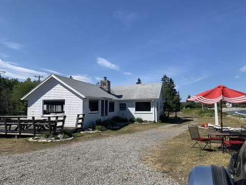 Side and front of cottage from parking area.