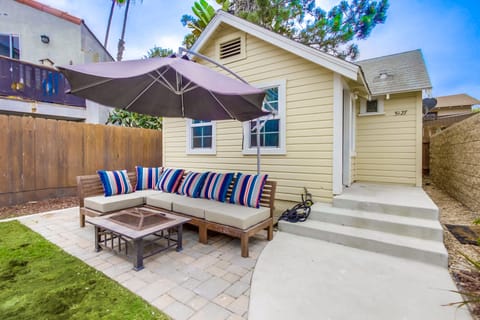 Front yard entertaining space with fire pit.
