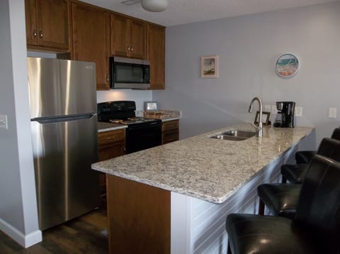 Fully equipped kitchen with new granite counter tops, cabinets and appliances!