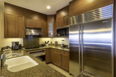 Excellently equipped and fully stocked chef's kitchen will making dining in an enjoyable event.