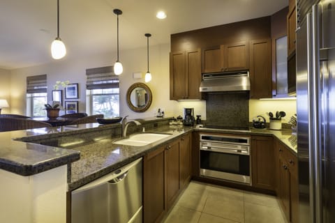 In the center of the action, the kitchen is part of an open great room with the dining area and living room; views take your eye straight outdoors to the magnificent ocean beyond.