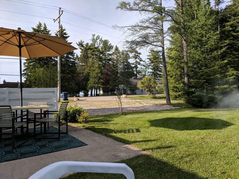 Outdoor patio overlooking parking and part of the lake