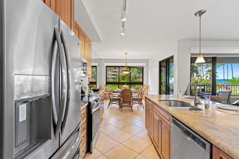 Kitchen with views of the courtyard and ocean in the distance