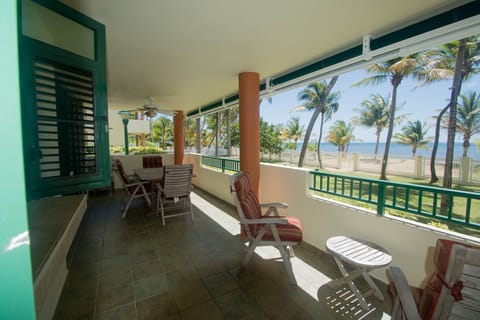 Beach and patio view from terrace. 