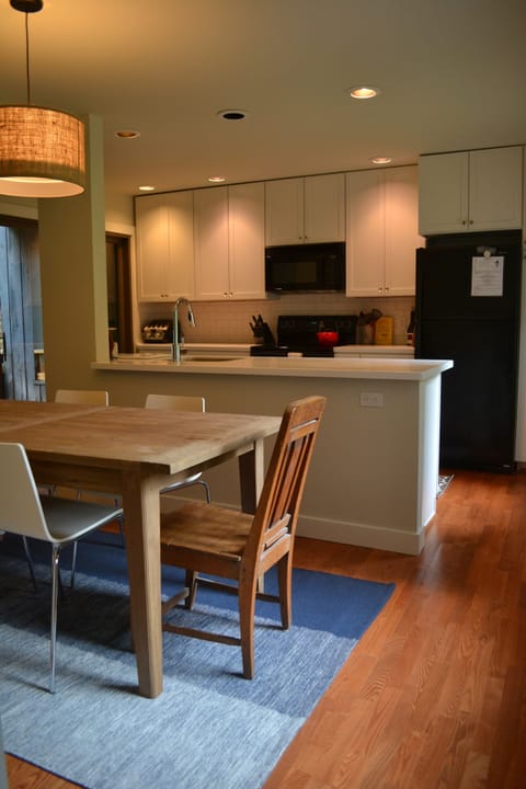 Modern Kitchen with new Corian counter tops, appliances, and dining area.