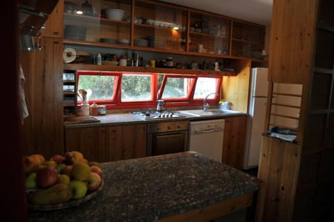 Kitchen with all appliances and a breakfast bar.