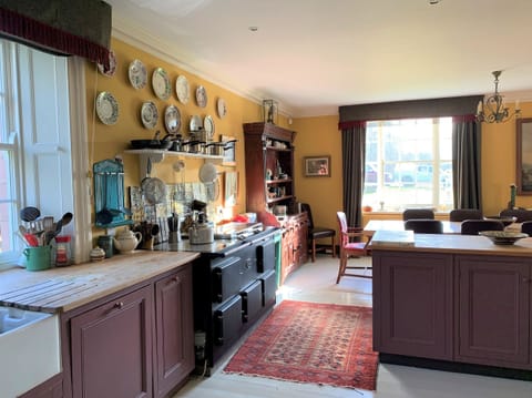 The farmhouse kitchen leads into the Dining Room 