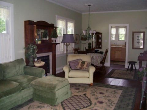 A pleasant living space w/ ample seating, flat screen TV, fireplace, piano more.