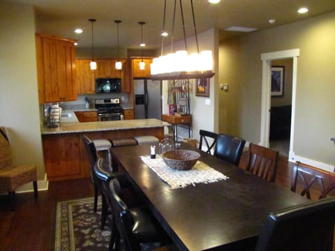 View of the amazing table & bar into kitchen