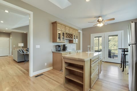 Spacious Gourmet Kitchen with Island. Doors open to Screened In Porch
