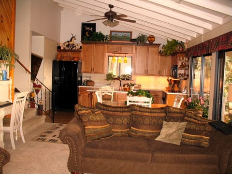 Living area. The whole house faces the view off the back. Comfy furniture!