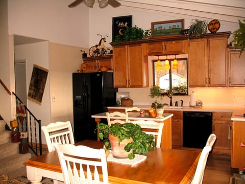 Kitchen, Staircase going to bedrooms & hallway going to 1/2 bath & laundry are