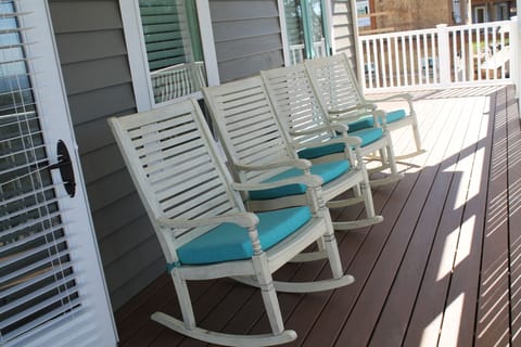 Relax on the mid-level deck, complete with views and four rocking chairs