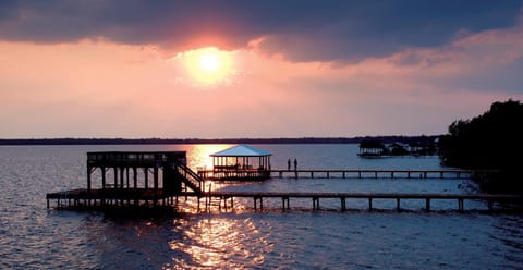 Picture yourself on the boat house with the blue roof.