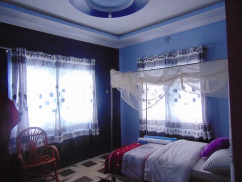 Bedroom 1. Spacious, great views though the windows. Warm and cool colors...