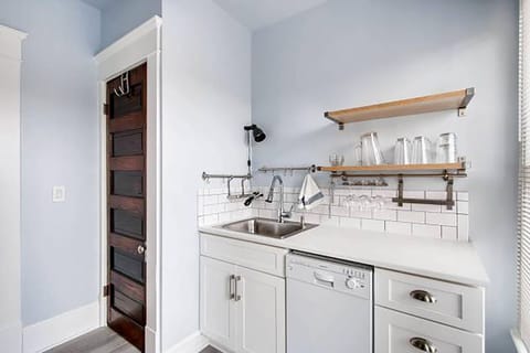Cleaning side of galley kitchen with laundry closet