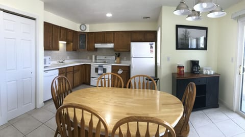 The open kitchen has all you need along with a coffee bar and table for six.