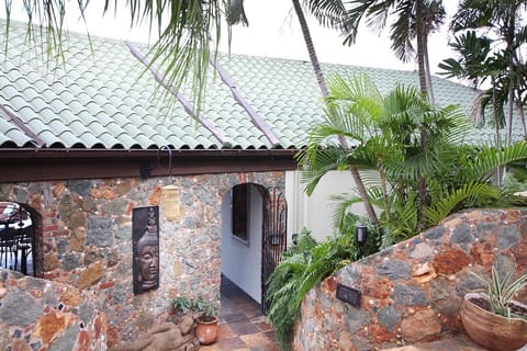 Entrance to villa is a unique iron gate.