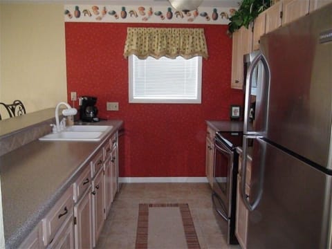 Kitchen with stainless steel appliances.