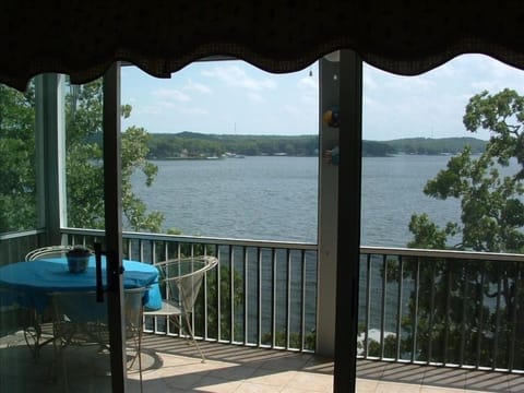 Large screened balcony on the lake. Also has a rocking chair and porch swing.
