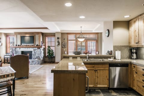 Bright kitchen looking out onto the balcony and living room.