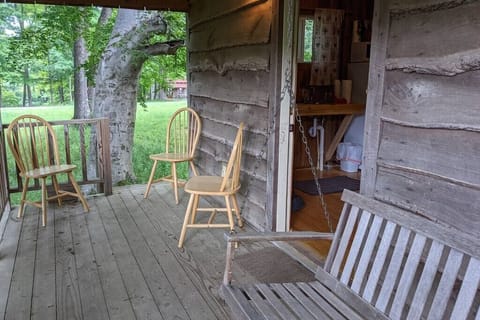 Back porch - swing and additional chairs.