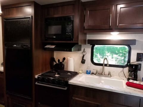 Kitchen appliances, utensils, dinner and silverware Camper B