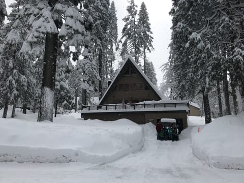Front of cabin in snow.