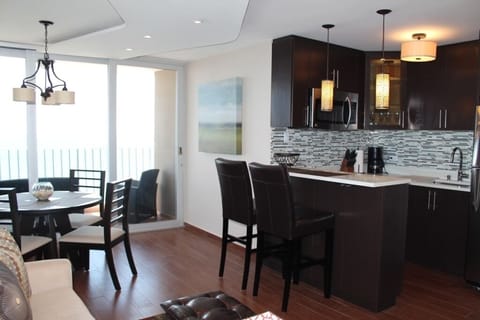 Open layout - kitchen, bar and dining area.