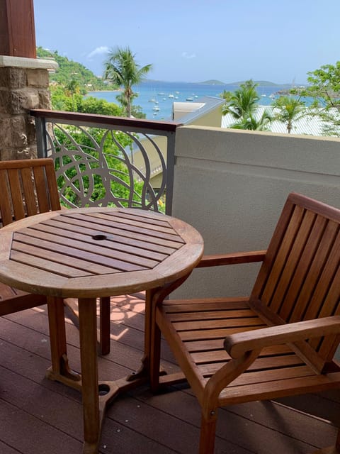 Balconies overlook beautiful grounds and the bay beyond