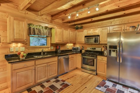 Fully stocked gourmet kitchen, granite counter tops, stainless steel appliances