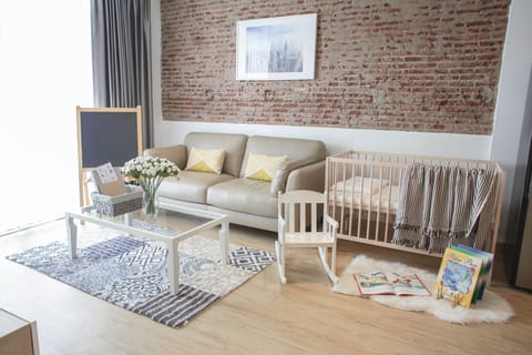 Living Area with baby cot