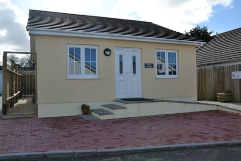 Front elevation with gates each side to enclose decking area 