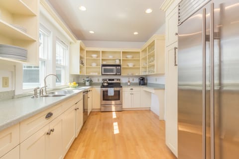 the main kitchen with appliances and 48" sub zero