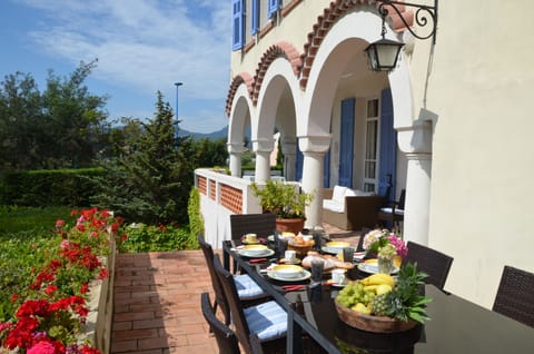 Dining Terrace looking towards the covered seating area and mountains