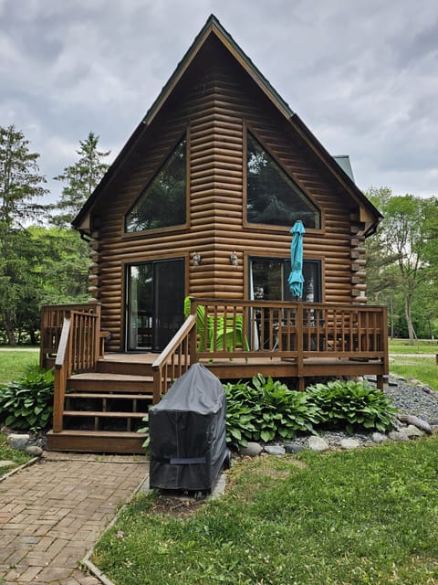 Back Deck with Bench seating and Table. 
Charcoal grill, bring charcoal 