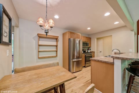 Eat in Kitchen w/ bench seating and bar seating/island.