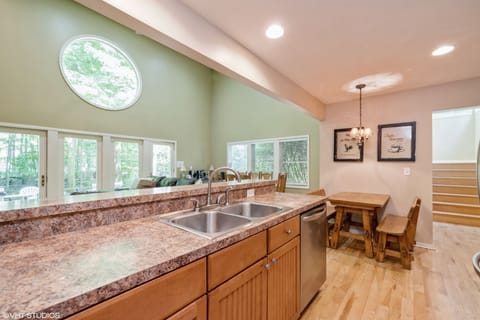 Kitchen counter with island and bench seating.