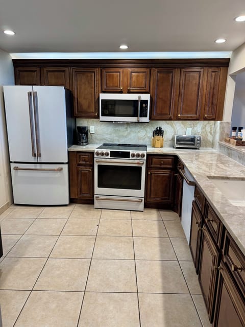 Remodeled kitchen: Cafe appliances, quartzite