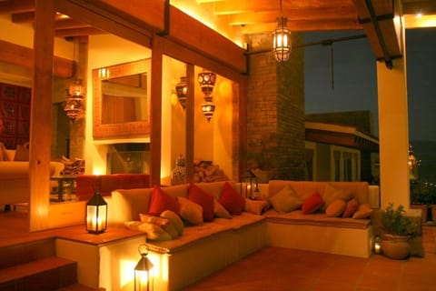Outdoor terrace at night with Moroccan lanterns
