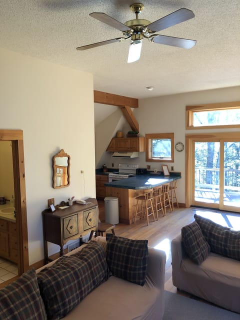 Cathedral ceilings with fan, kitchen view